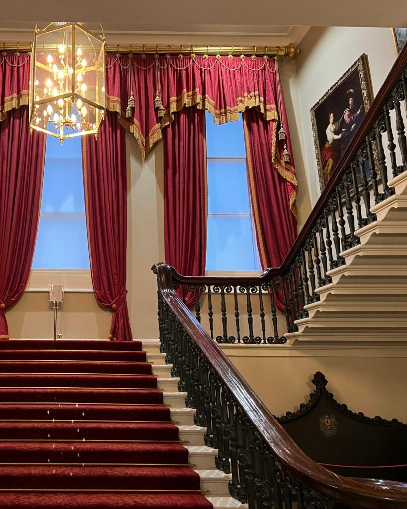 RENZIONI brand image placeholder, a staircase beneath a chandelier
